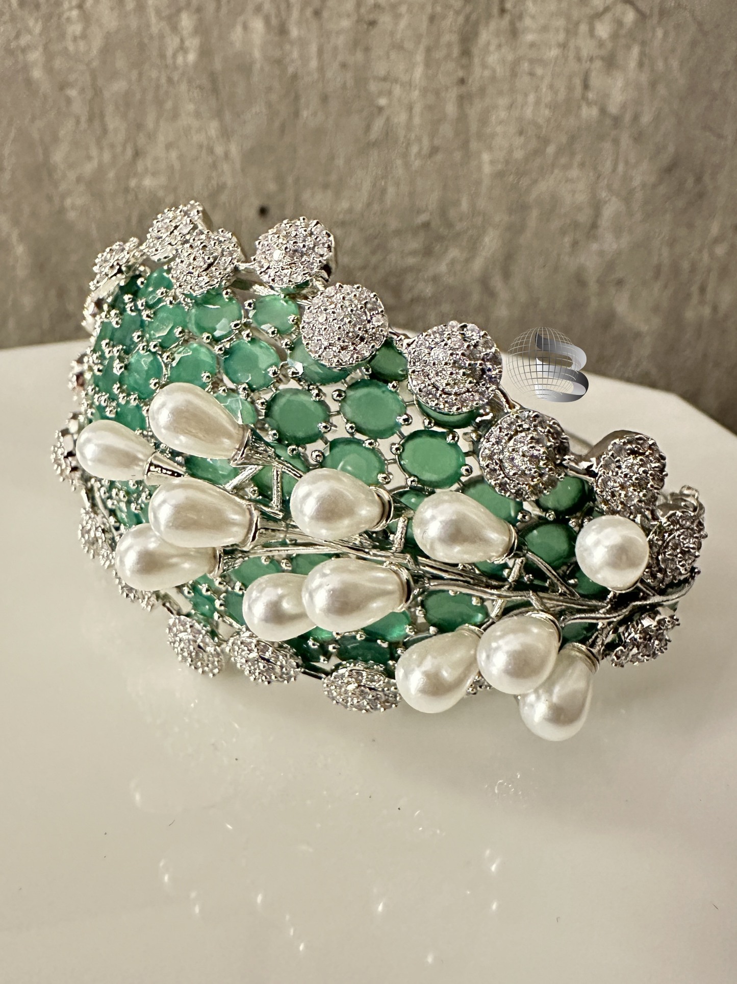 Silver Toned Mint Green Stones and American Diamonds Studded Adjustable Bracelet with 3D Pearl Work