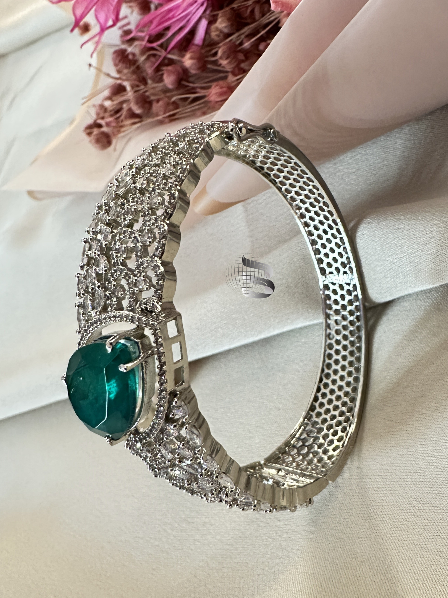 Silver-Toned American Diamond Bracelet with Emerald Centerpiece