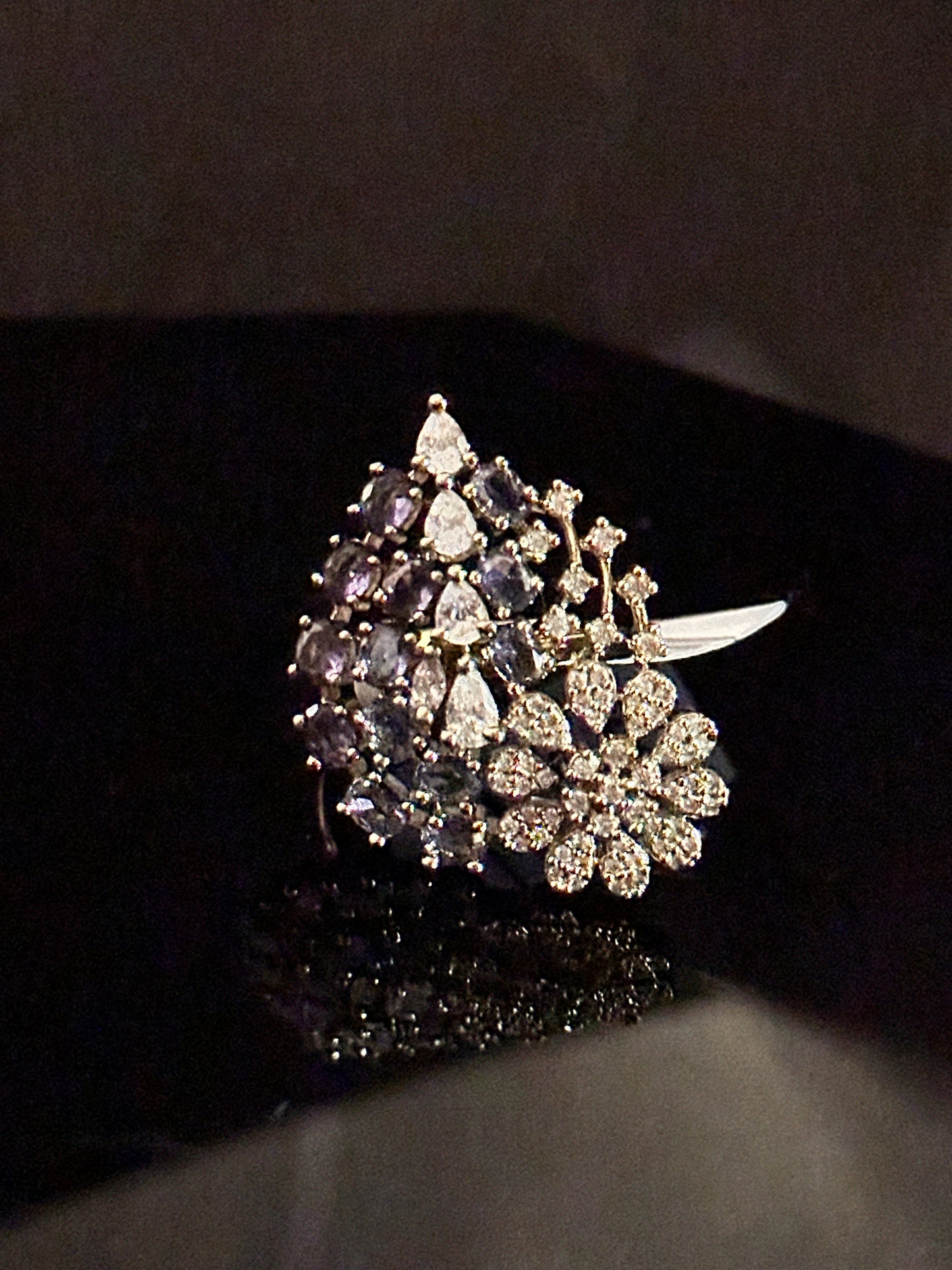 Golden American Diamond Ring studded with purple stones