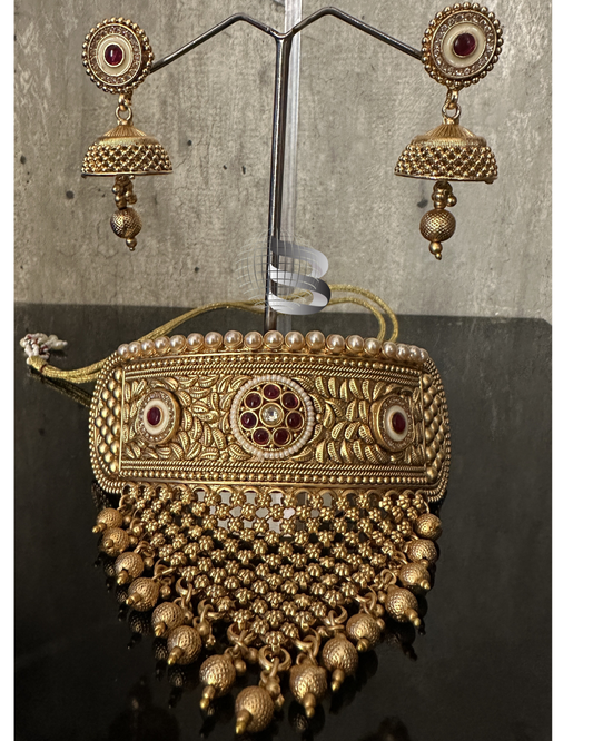 Golden Red Stone Studded Enamel and American Diamond work Choker Set